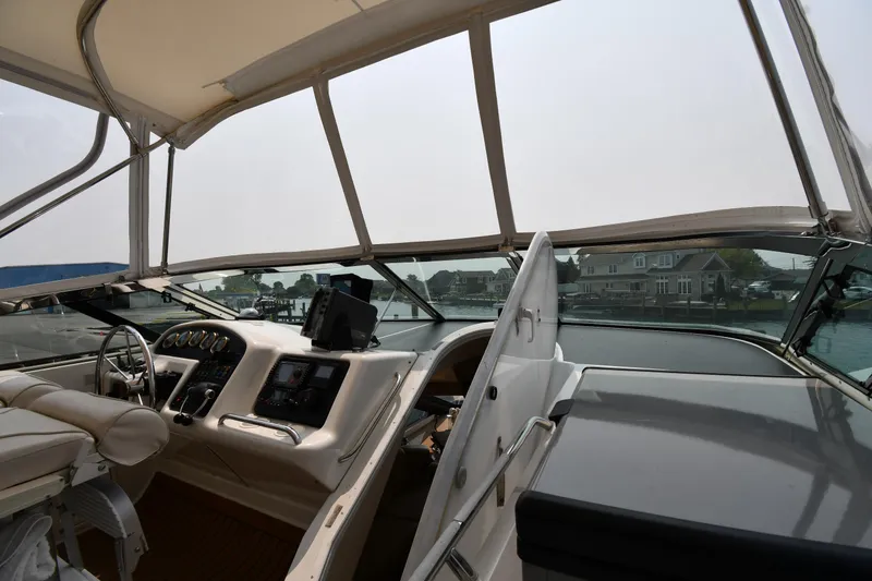 Slide: The Image of Interior view of 1998 Carver 530 Voyager Pilothouse yacht cockpit with steering and navigation controls. - 18