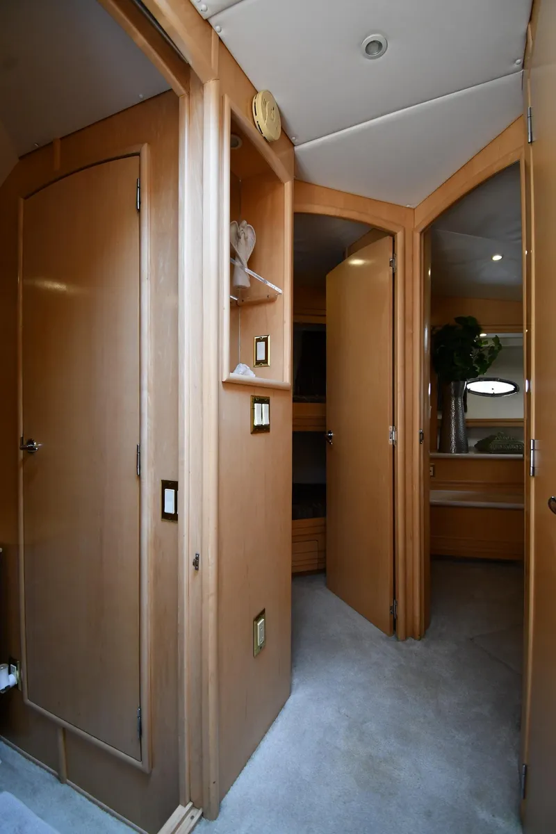 Slide: The Image of Interior of 1998 Carver 530 Voyager Pilothouse with wooden cabinetry and carpeted flooring. - 37