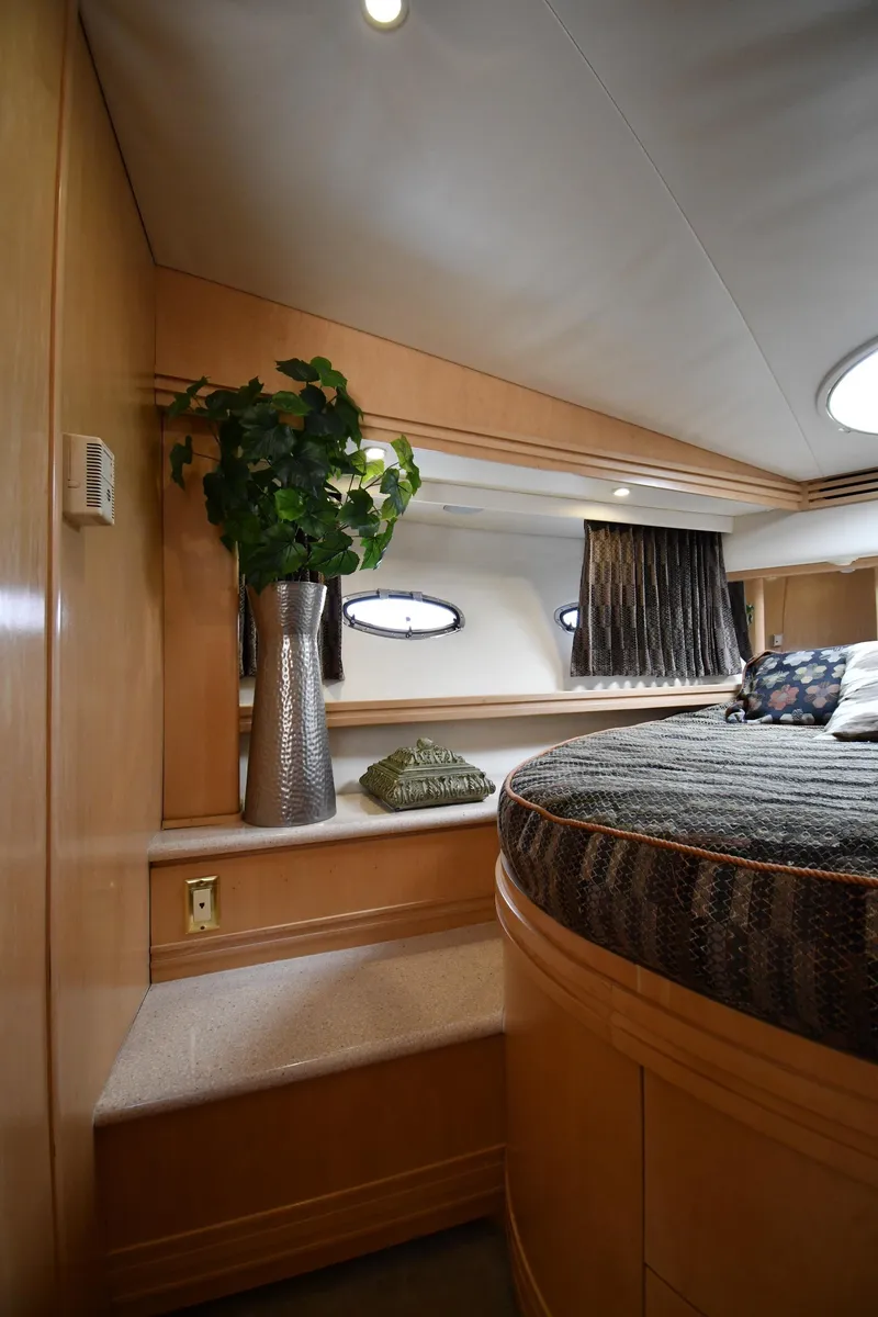 Slide: The Image of Luxurious interior of 1998 Carver 530 Voyager Pilothouse with elegant decor and cozy bedding. - 41