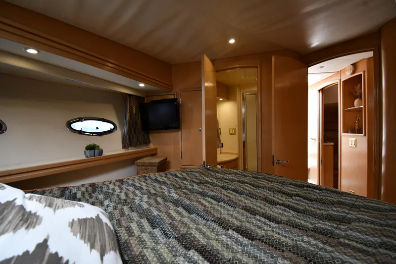 Slide: The Image of Luxurious interior of 1998 Carver 530 Voyager Pilothouse yacht bedroom. - 43