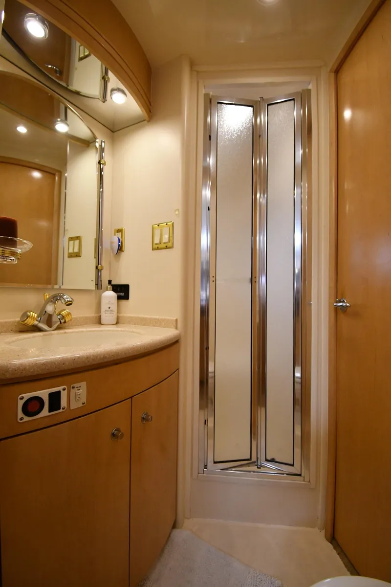 Slide: The Image of 1998 Carver 530 Voyager Pilothouse bathroom with modern fixtures and shower. - 48