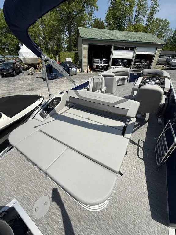 Slide: The Image of 2023 Bennington 22 SXSB pontoon boat with spacious seating and modern design. - 22