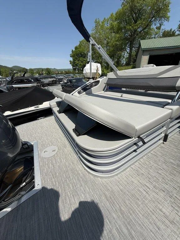 Slide: The Image of 2023 Bennington 22 SXSB pontoon boat with sleek seating and modern design. - 24