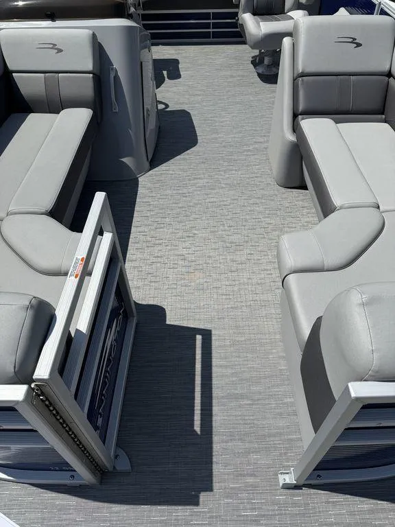 Slide: The Image of 2023 Bennington 22 SXSB pontoon boat interior with gray seating and flooring. - 6