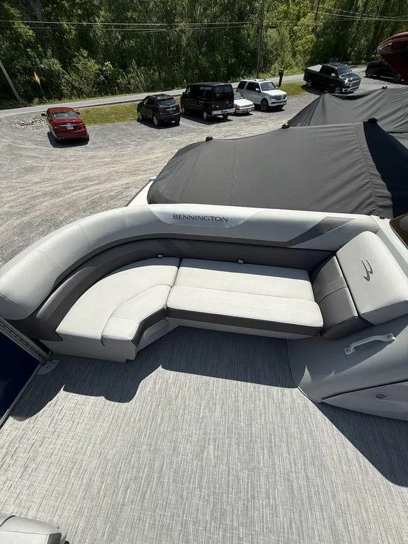 Slide: The Image of 2023 Bennington 22 SXSB pontoon boat with spacious seating and sleek design. - 9