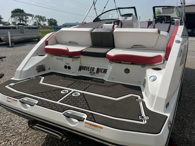 Slide: The Image of 2021 Scarab 255 ID boat with red and white seating, rear view. - 10