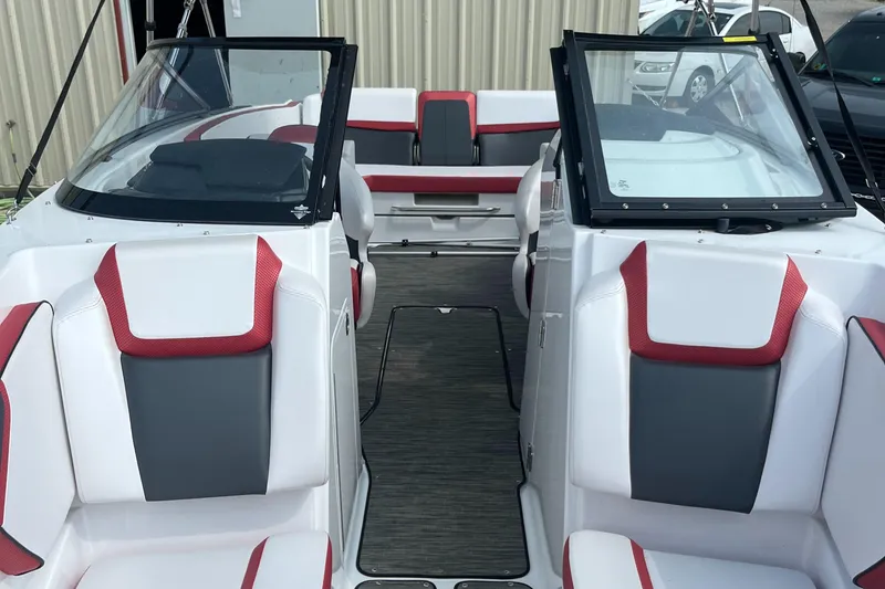Slide: The Image of 2021 Scarab 255 ID boat interior with red and gray seating, open cockpit view. - 3