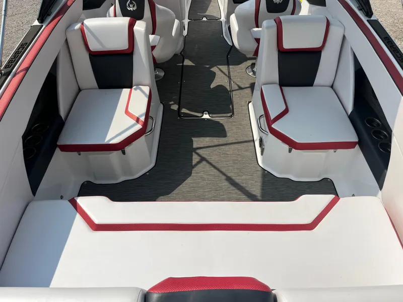 Slide: The Image of 2021 Scarab 255 ID boat interior with white and red seating, modern design. - 9