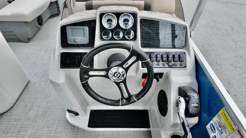 Slide: The Image of Steering console of 2026 Sylvan Mirage 822 PARTY FISH boat with gauges and controls. - 6