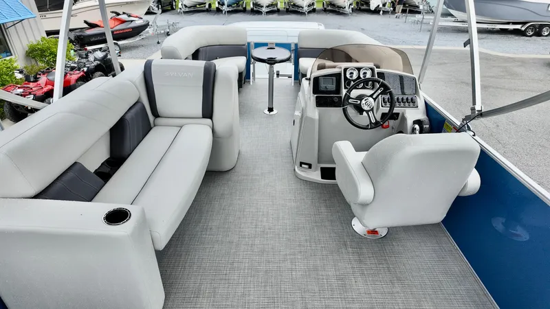 Slide: The Image of 2026 Sylvan Mirage 822 PARTY FISH pontoon boat interior with seating and helm. - 8