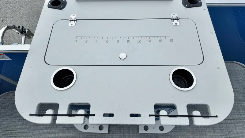 Slide: The Image of 2026 Sylvan Mirage 822 PARTY FISH boat deck with cup holders and measuring scale. - 9