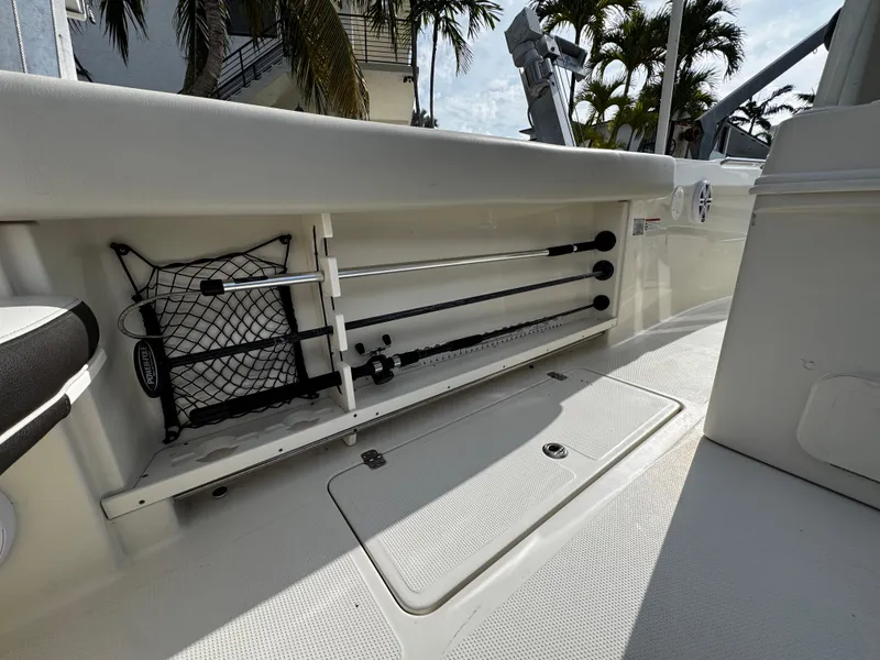 Slide: The Image of Interior view of a 2022 Sailfish 290 CC boat, showcasing storage compartments. - 14