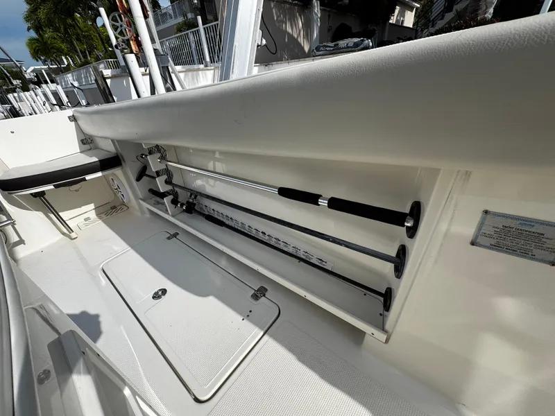 Slide: The Image of 2022 Sailfish 290 CC boat interior with rod storage compartment. - 30