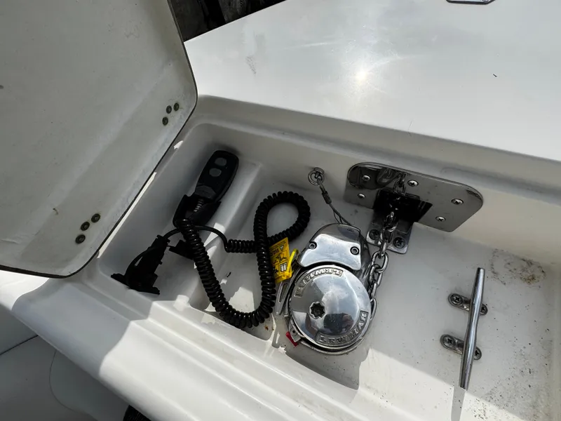 Slide: The Image of Anchor compartment of 2022 Sailfish 290 CC boat with winch and remote control. - 41