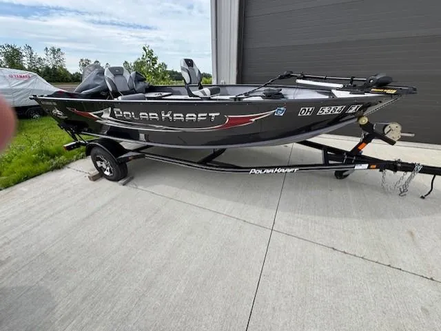 The Image of 2018 Polar Kraft Outlander 156 SC boat on trailer, parked outdoors. - 1