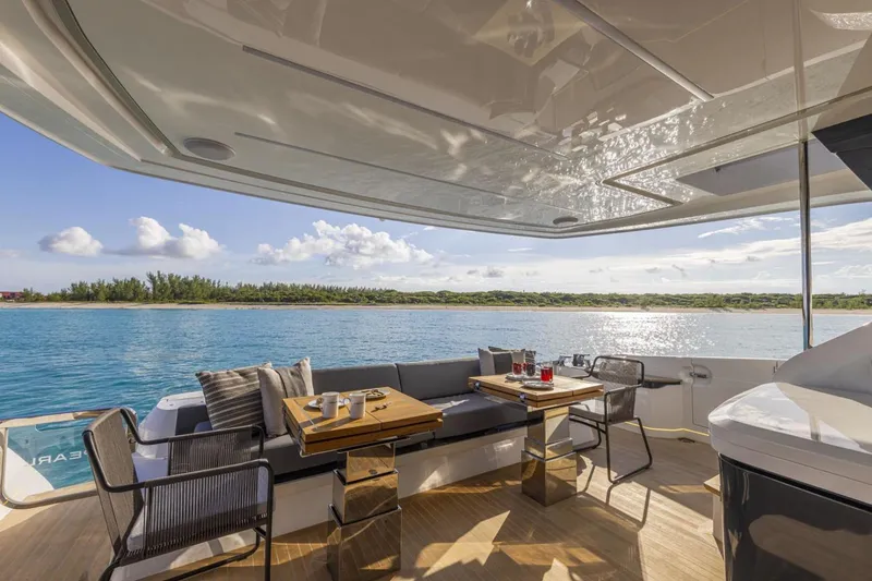 Slide: The Image of Luxurious 2023 Pearl 72 Motor Yacht deck with elegant seating and ocean view. - 28