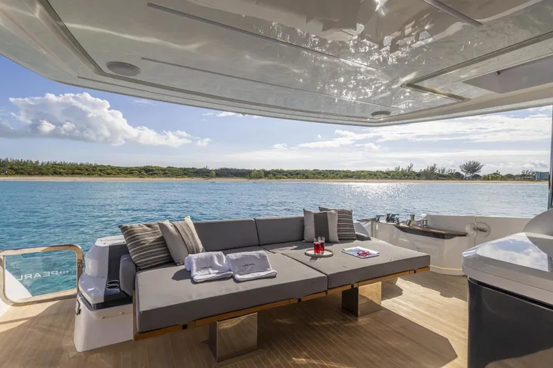 Slide: The Image of Luxurious deck of 2023 Pearl 72 Motor Yacht with ocean view and comfortable seating. - 29