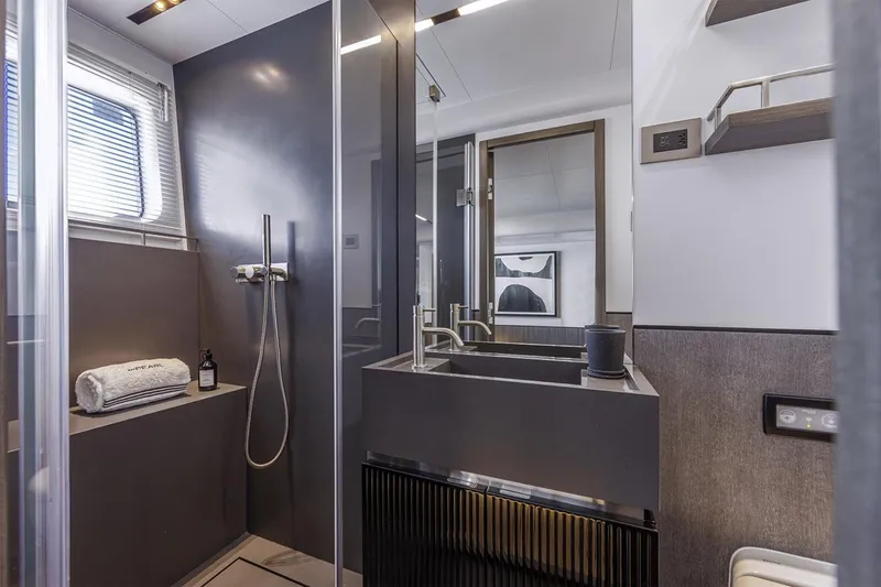 Slide: The Image of Luxurious bathroom in 2023 Pearl 72 Motor Yacht with modern fixtures and sleek design. - 7