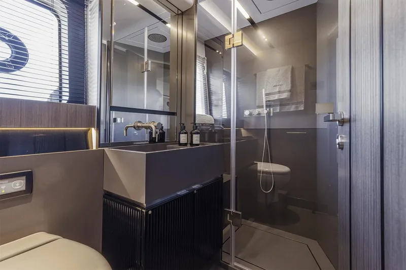 Slide: The Image of Luxurious bathroom interior of 2023 Pearl 72 Motor Yacht with modern fixtures and glass shower. - 9