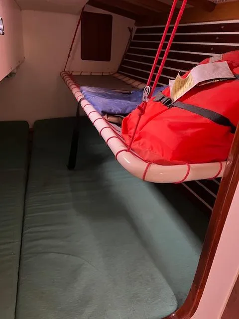 Slide: The Image of Interior of 2003 Custom 38 C/R boat with bunk beds and life jacket. - 10