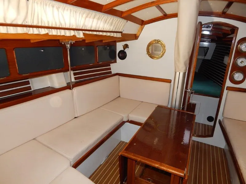 Slide: The Image of Luxurious 2003 Custom 38 C/R yacht interior with elegant wood and cream upholstery. - 29