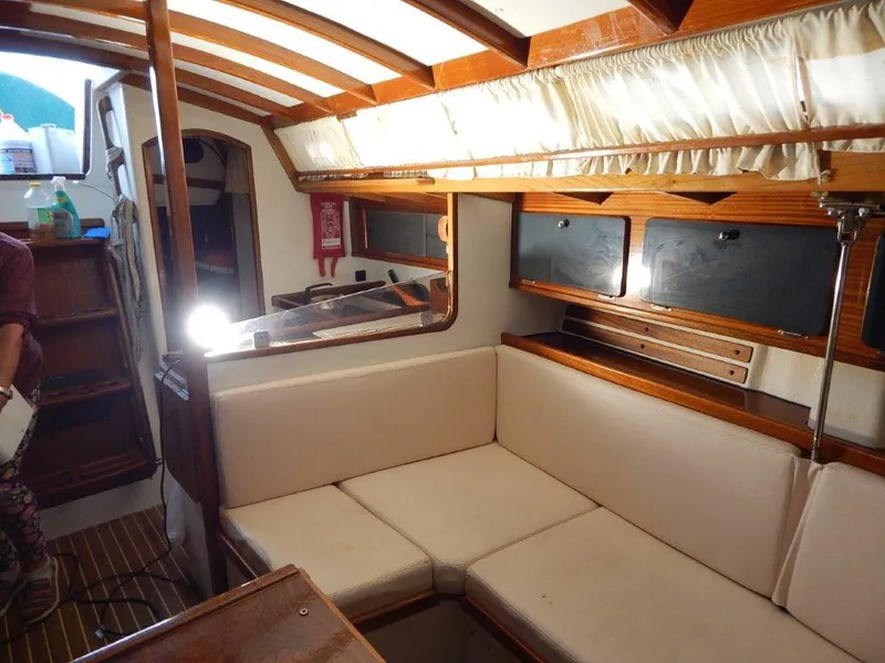 Slide: The Image of Interior of 2003 Custom 38 C/R boat with cozy seating and wooden accents. - 30