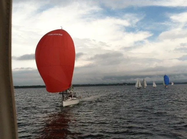 Slide: The Image of Sailboat with red spinnaker on water, Custom 38 C/R, 2003 model, cloudy sky. - 32
