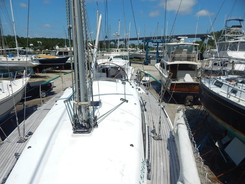 Slide: The Image of Sailboat docked at marina, Custom 38 C/R, 2003 model, surrounded by other boats. - 6