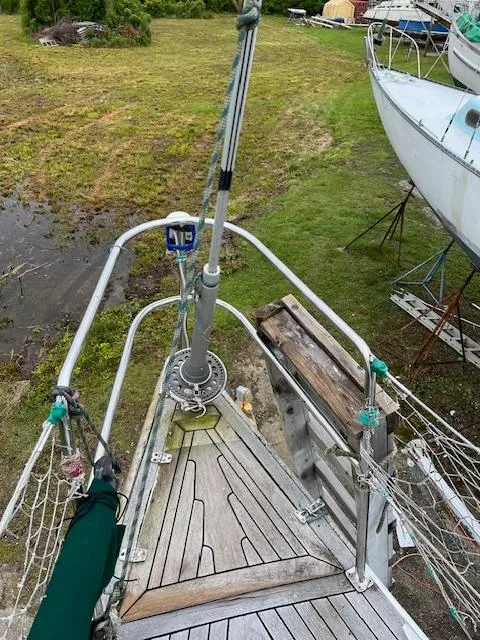 Slide: The Image of Bow of a 2003 Custom 38 C/R sailboat on land, with visible rigging and deck details. - 8