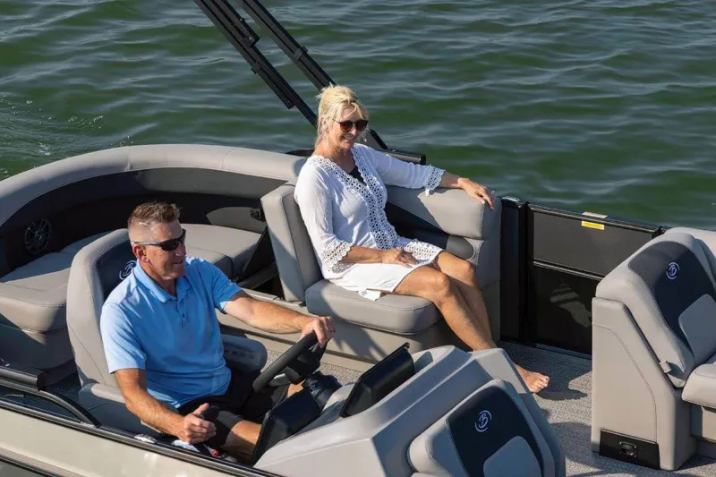 Slide: The Image of Couple enjoying boat ride on Barletta Aria 20 L, 2026 model. - 2
