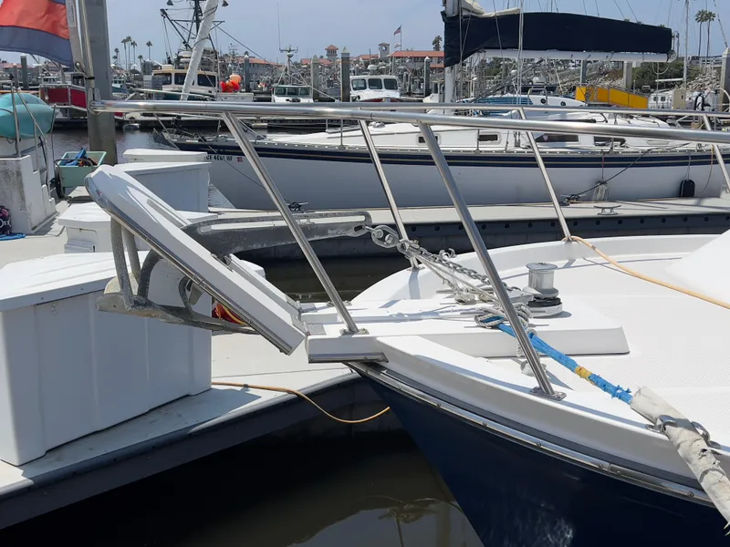 Slide: The Image of 2001 Norstar 301 boat docked at marina with anchor and railing visible. - 11