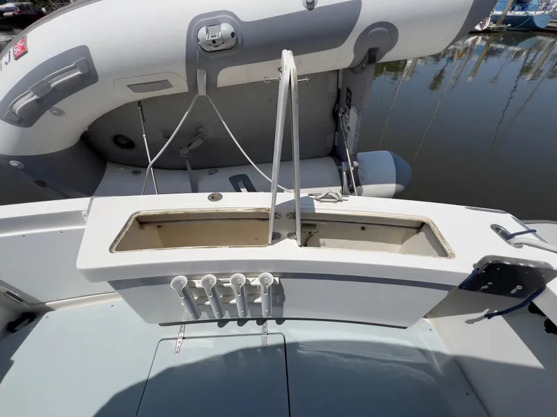 Slide: The Image of 2001 Norstar 301 boat deck with storage compartment and control panel. - 19