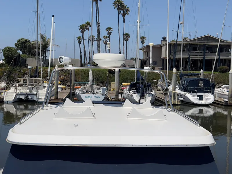 Slide: The Image of Norstar 301 boat docked at marina, surrounded by sailboats and palm trees, 2001 model. - 20