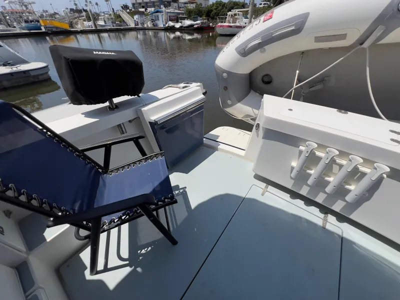 Slide: The Image of Boat deck with chair, cooler, and inflatable boat; Norstar 301, 2001 model. - 21