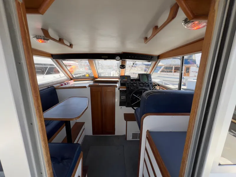 Slide: The Image of Interior of 2001 Norstar 301 boat with seating and navigation equipment. - 26
