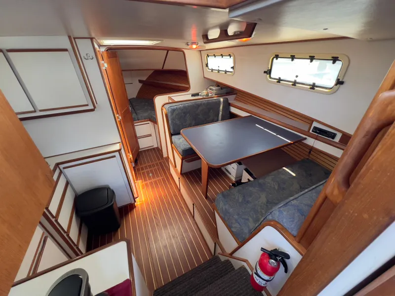 Slide: The Image of Interior of 2001 Norstar 301 boat with dining area and wooden finishes. - 33