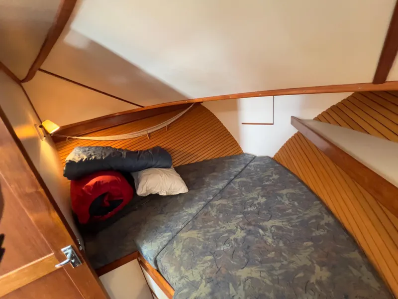 Slide: The Image of Cozy cabin interior of 2001 Norstar 301 boat with bedding and wooden accents. - 41
