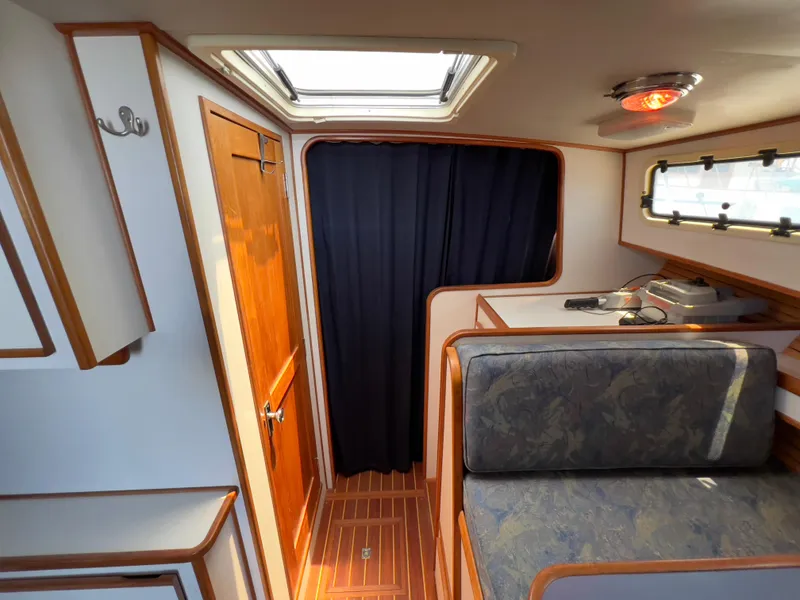 Slide: The Image of Interior of 2001 Norstar 301 boat with wood accents and seating area. - 45