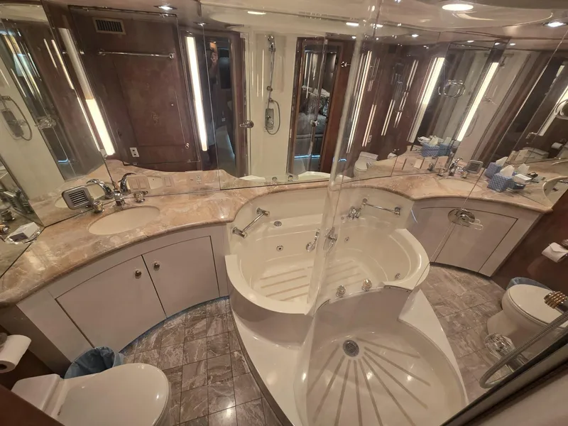Slide: The Image of Luxurious bathroom in 1994 Hatteras 82 Convertible yacht with elegant fixtures and spacious design. - 24