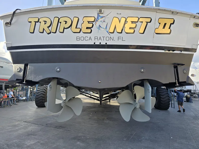 Slide: The Image of 1994 Hatteras 82 Convertible yacht, "Triple Net II," docked in Boca Raton, Florida. - 40