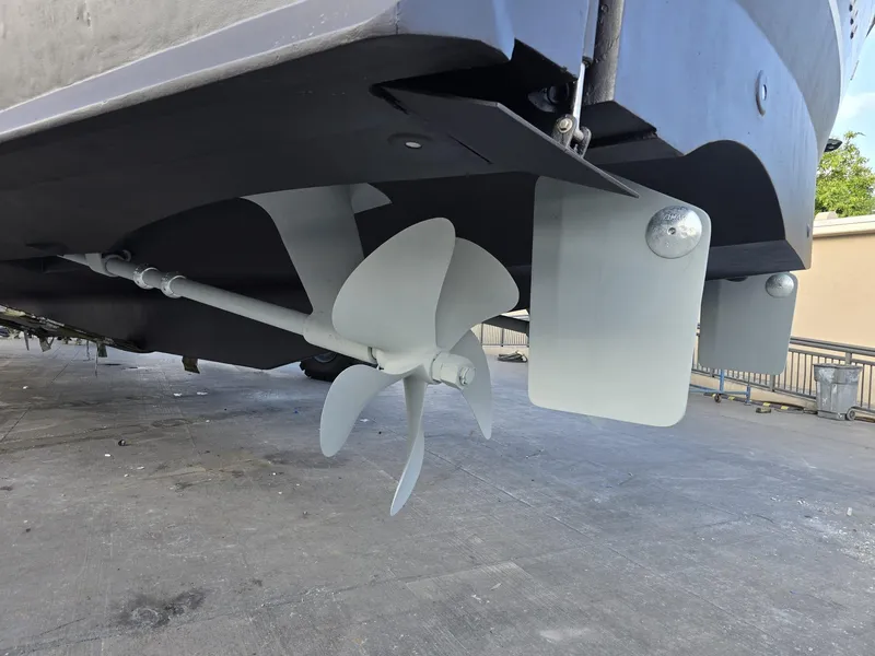 Slide: The Image of Propeller and rudder of 1994 Hatteras 82 Convertible yacht on dry dock. - 48