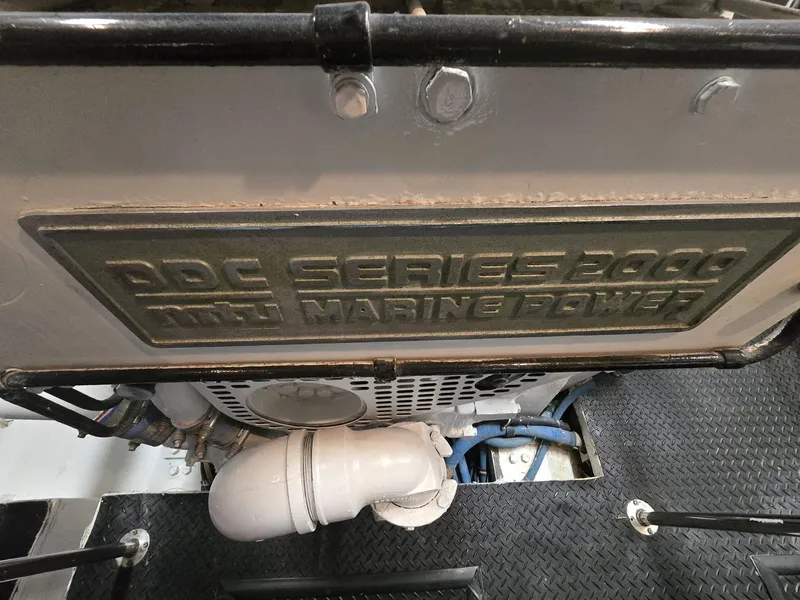 Slide: The Image of Engine compartment of 1994 Hatteras 82 Convertible with DDC Series 2000 MTU Marine Power. - 51