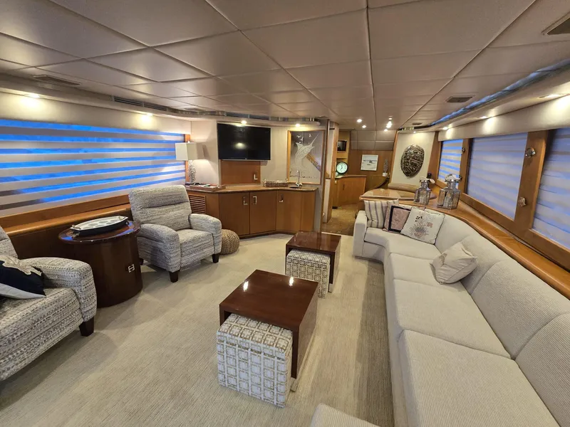 Slide: The Image of Luxurious interior of 1994 Hatteras 82 Convertible yacht with plush seating and modern decor. - 8
