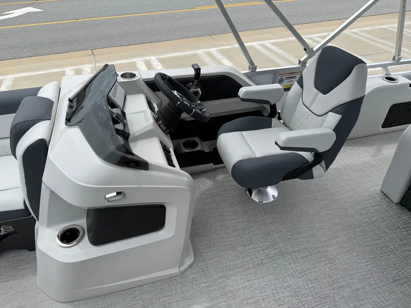 Slide: The Image of 2025 Avalon LSZ Versatile Rear Lounger boat interior with modern helm and comfortable seating. - 12