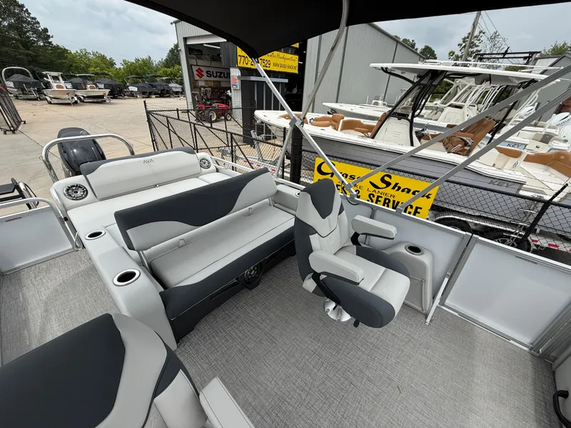Slide: The Image of 2025 Avalon LSZ Versatile Rear Lounger boat interior with seating and steering wheel. - 13