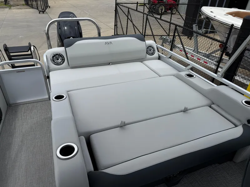 Slide: The Image of 2025 Avalon LSZ Versatile Rear Lounger boat with spacious seating and cup holders. - 16