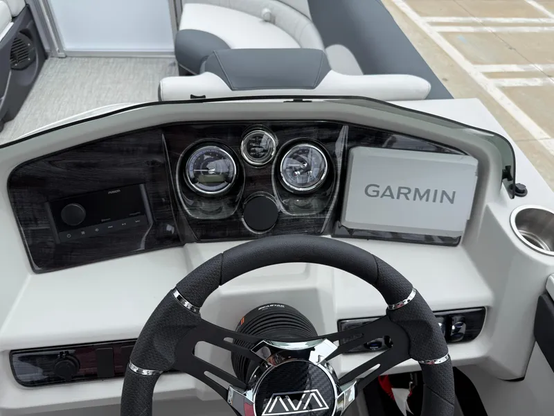 Slide: The Image of 2025 Avalon LSZ Versatile Rear Lounger dashboard with Garmin navigation system. - 27
