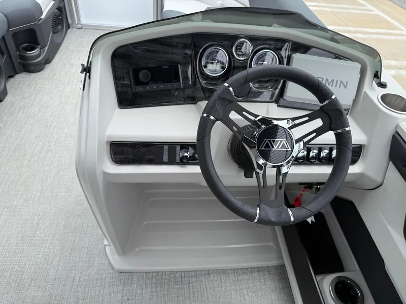 Slide: The Image of 2025 Avalon LSZ Versatile Rear Lounger dashboard with steering wheel and control panel. - 32