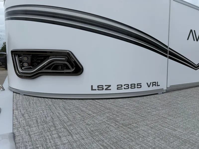 Slide: The Image of 2025 Avalon LSZ Versatile Rear Lounger boat, model LSZ 2385 VRL, close-up view. - 36