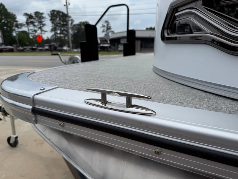Slide: The Image of 2025 Avalon LSZ Versatile Rear Lounger boat detail with cleat and sleek design. - 39